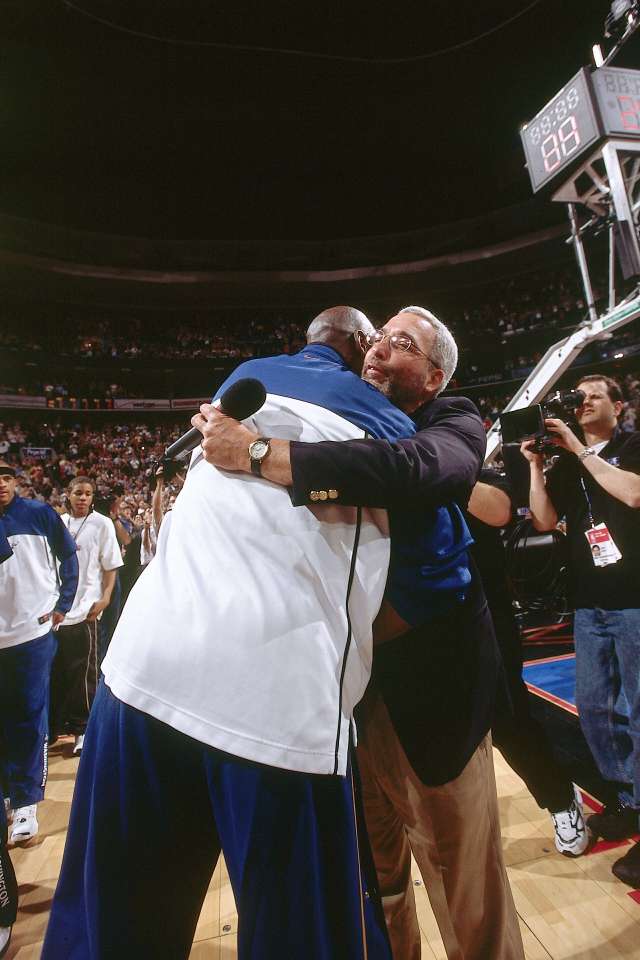 PHILADELPHIA - APRIL 16:  Michael Jordan #23 of the Washington Wizards receives a hug from former Chicago Bulls announcer Ray Clay prior to the last NBA game of his career, played against the Philadelphia 76ers at First Union Center on April 16, 2003 in Philadelphia, Pennsylvania.  The Sixers won 107-87.  NOTE TO USER: User expressly acknowledges and agrees that by downloading and/or using this Photograph, User is consenting to the terms and conditions of the License Agreement  Mandatory Copyright Notice:  Copyright 2003 NBAE  (Photo by Nathaniel S. Butler/NBAE via Getty Images)