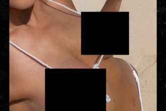 Revealed: The Sultry Star Turning Heads with Her Dazzling Pearl Bikini Selfie!