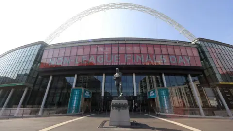 Getty Images A glass fronted sport's stadium. 